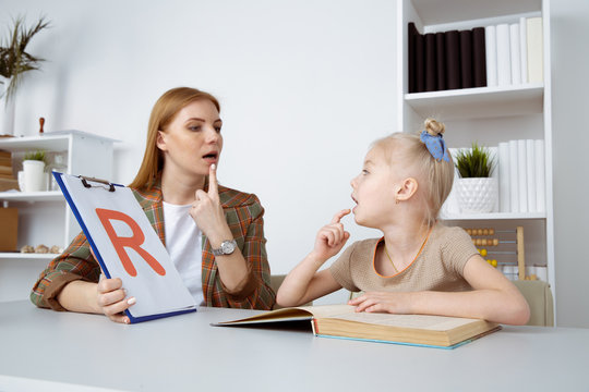 A therapist conducting ABA therapy with a child